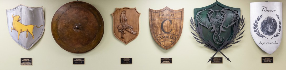 Photo of house shields hanging on a wall