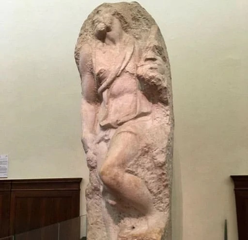 Unfinished marble sculpture of a man